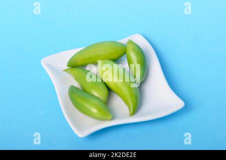 Achocha in a saucer on a blue background Stock Photo
