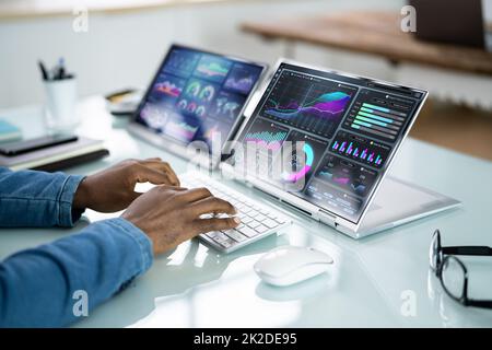 African Advisor Using KPI Dashboard Stock Photo