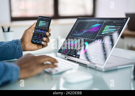 African Advisor Using KPI Dashboard Stock Photo
