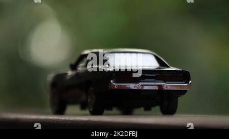A black die cast toy car. Stock Photo