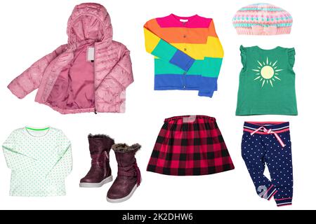 Collage set of little girl spring clothing isolated on a white background. The collection of a stylish pink down jacket, a sweater, a jeans skirt, boots, shirts and pants. Kids autumn and summer fashion. Stock Photo
