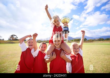 The field holds promise. Shot of a childrens soccer team. Stock Photo