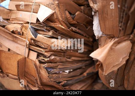Bring your cardboard to be recycled. used cardboard ready to be recycled. Stock Photo