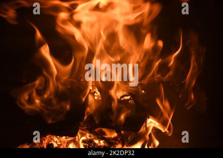 Cozy and warming log fire in the fireplace, in the province of Alicante, Spain Stock Photo