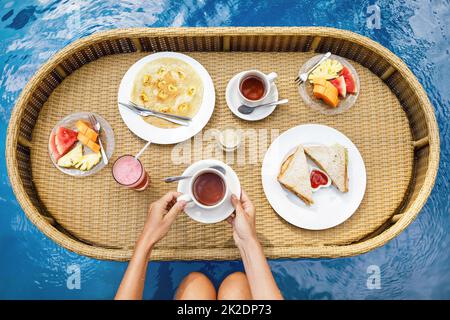 Floating breakfast in the swimming pool Stock Photo
