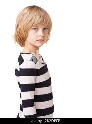 Striped sweetheart. Portrait of a pretty little girl standing profile against a white background. Stock Photo