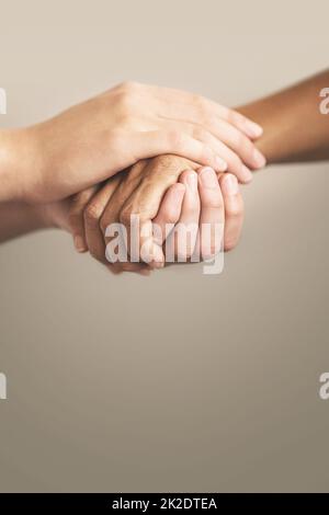 A shot of a male fingers holding two colorful markers isolated on a ...