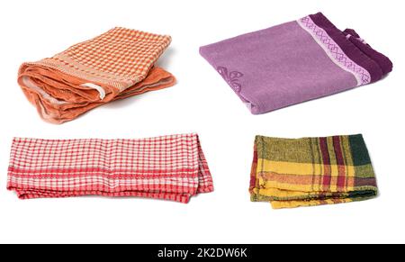 folded kitchen textile towels of different colors on a white background, set Stock Photo