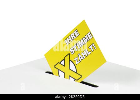 Your vote counts german - Envelope in ballot box Stock Photo