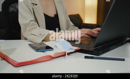 Close up Female hands of business woman professional user worker using typing on laptop notebook keyboard Stock Photo