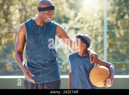 Happy father, son and basketball of black people ready for a match, teaching and learning in a court. African man and boy in sport motivation exercise Stock Photo