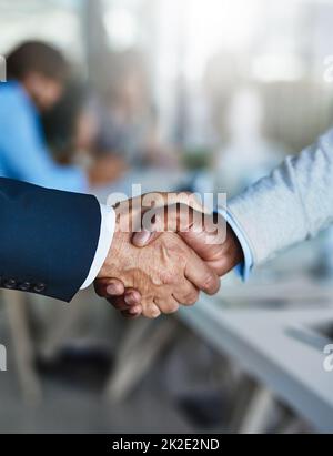 Win-win business deals are the way to go. Cropped shot of two businessmen shaking hands during a meeting at work. Stock Photo