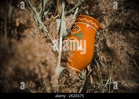 brown clay jug in the sun Stock Photo