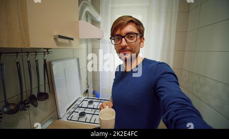 Point of view shot of man making online video call holding device with camera talking and gesturing looking at camera. Internet and communication concept. POV Stock Photo