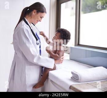 Just in for a routine pediatric checkup. Cropped shot of a female pediatrician doing a checkup on an adorable baby boy. Stock Photo