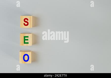 wooden cubes for SEO Search engine optimization  on gray background.Copy space. Stock Photo