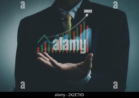 business concept .stock market finance.Index Fund.businessman trader growing virtual hologram of stocks invest in trading. Stock Photo