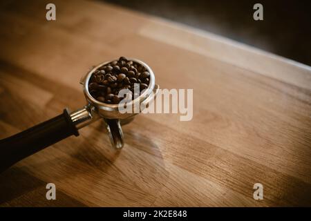 Fresh roasted coffee beans in an espresso filter Stock Photo