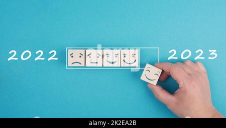 Loading bar with sad and happy faces, 2023 in progress, end of covid-19, back to normal Stock Photo