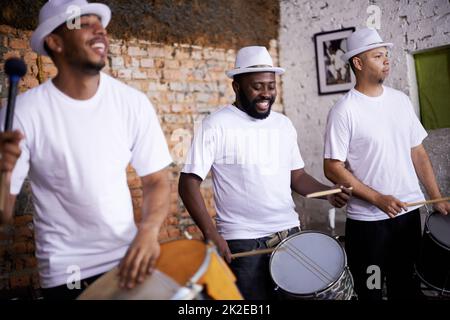 Feeling the rhythm in the drums. Cropped shot of a group of dummers. Stock Photo