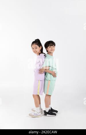 Korean boy and girl fitness and exercise concept in white background  exercising with friends Stock Photo