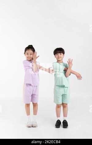 Korean boy and girl fitness and exercise concept in white background  practicing gymnastics Stock Photo