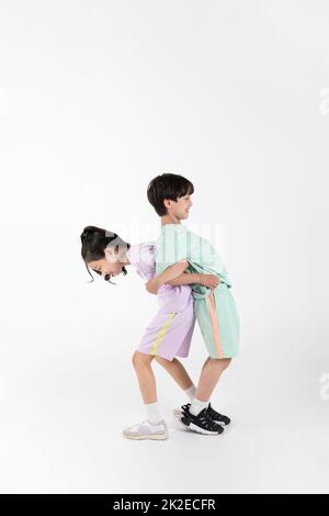 Korean boy and girl fitness and exercise concept in white background  exercising with friends Stock Photo