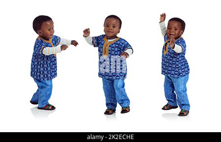 Doing the baby boogy. Composite image of an adorable african toddler dancing. Stock Photo