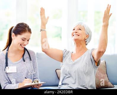 Your test came back negative. A doctor explaining positive test results to an overjoyed senior patient. Stock Photo