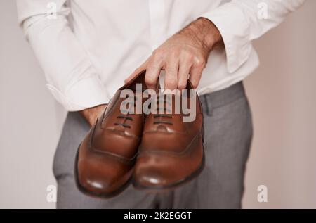 Unrecognizable Model Wearing Casual Outfit And Holding Leather