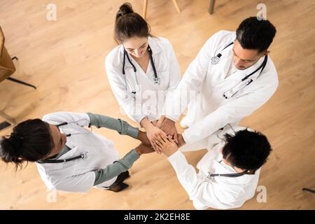 Medical Team Stacking Hands Against Stock Photo
