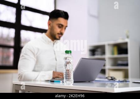 Water Bottle On Desk Stock Photo
