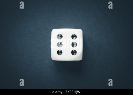 White dice on black table background Stock Photo