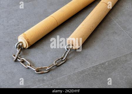 nunchaku, one of the close-up martial arts of the far east- nunchaku, made of handmade wood and chain Stock Photo