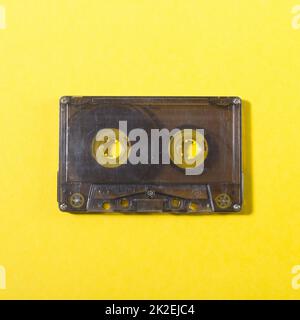 audio compact cassette on a yellow background Stock Photo