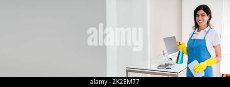 Happy Female Janitor In Office Stock Photo