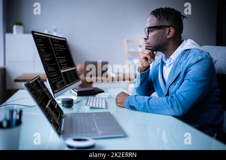 Software Programmer Coder Working On Computer Stock Photo