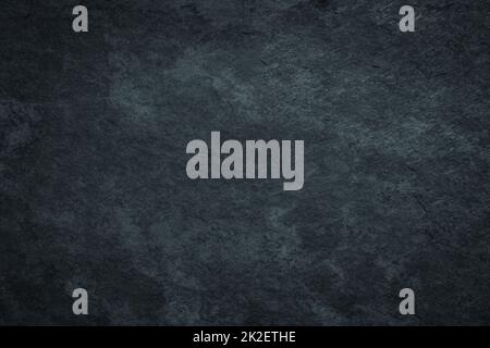 Dark gloomy black grunge surface background with scratched stained texture Stock Photo