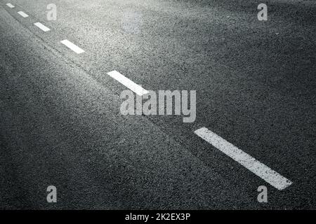 Dotted line on city asphalt road Stock Photo