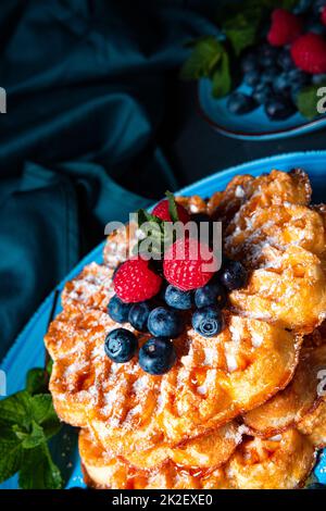 Simple sweet waffles with raspberries and blueberries Stock Photo