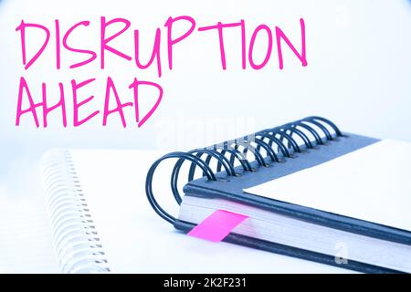 Hand writing sign Disruption Ahead. Business overview Transformation that is caused by emerging technology Blank Opened Spiral Notebook Placed On A Table Showing New Ideas Stock Photo