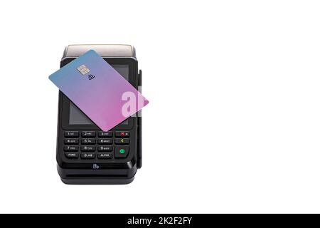 the plastic card lies on the payment terminal with a white isolated background Stock Photo