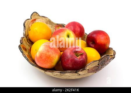 fresh fruits on a clay plate Stock Photo