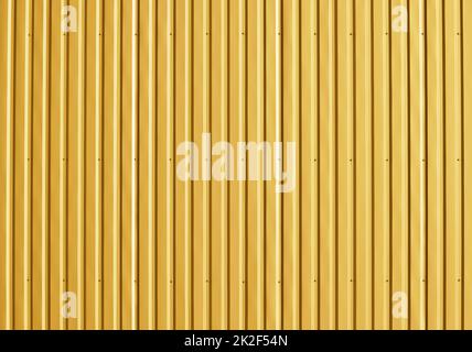 Golden aluminum corrugated metal wall Stock Photo