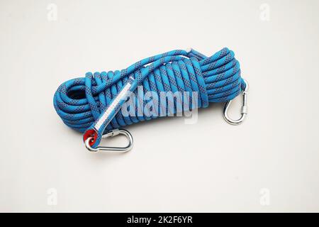 Blue climbing rope on white background Stock Photo