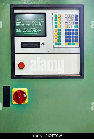 Its an oldie but a goodie. Closeup shot of a control panel on a piece of factory machinery. Stock Photo