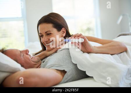 Theres a bundle of joy on its way. Shot of a mature couple feeling excited after taking a home pregnancy test. Stock Photo