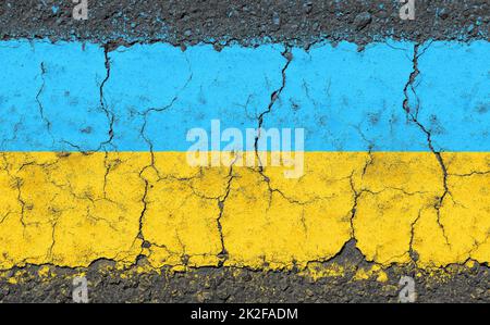 Grunge damaged flag of Ukraine on cracked concrete Stock Photo
