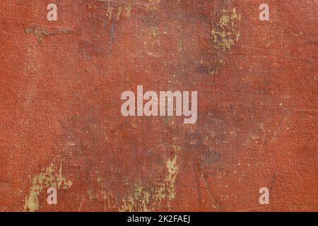Grunge red painted plaster wall background Stock Photo