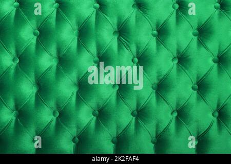 Green capitone tufted fabric upholstery texture Stock Photo